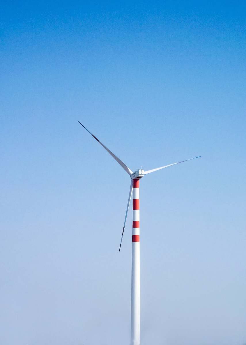 machine white and red windmill during daytime engine